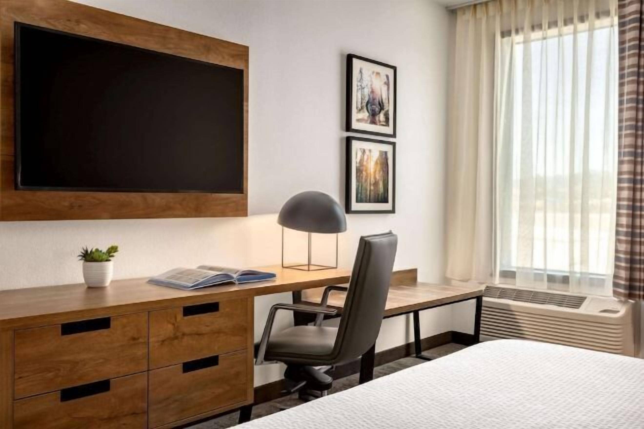 Hypo-allergenic bedding, pillowtop beds, desk, laptop workspace