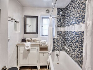 Bathtub, hair dryer, towels