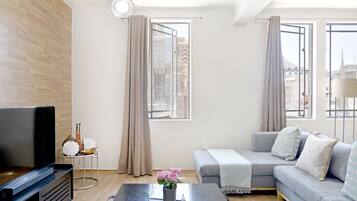 Apartment | Living area | 32-inch Smart TV with digital channels, streaming services