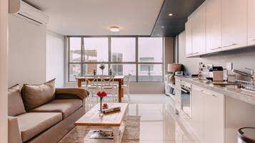 Apartment, 1 Bedroom | Living area | 32-inch flat-screen TV with digital channels, Smart TV, Netflix