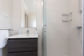 Shower, towels, soap, toilet paper