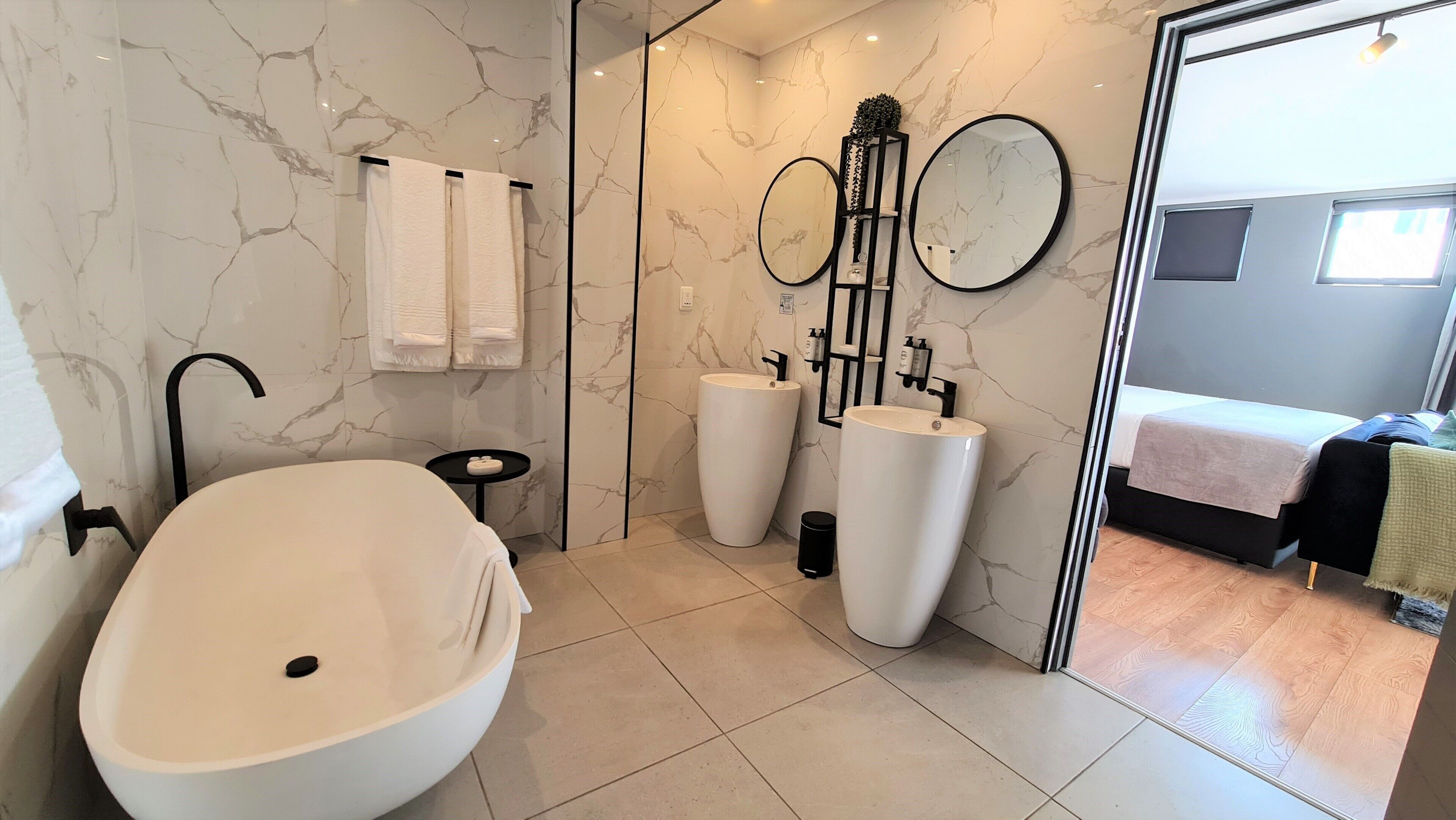 007 suite | bathroom | shower, hair dryer, towels