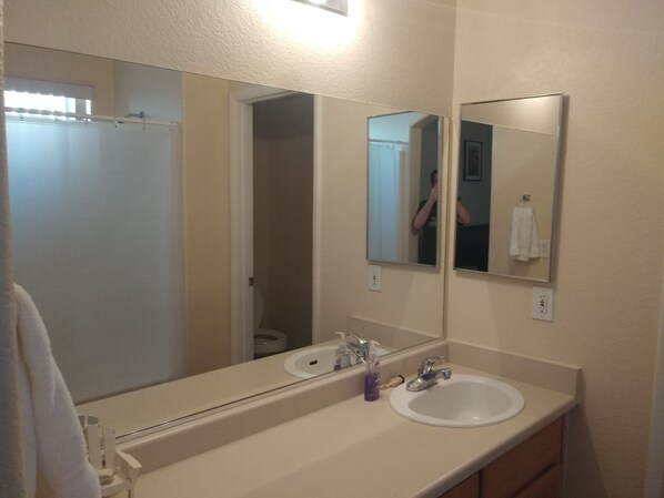 Combined shower/tub, hair dryer, towels, soap