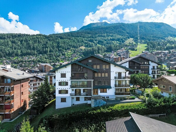 Residents enjoy stunning views of the surrounding hills from their balconies.
