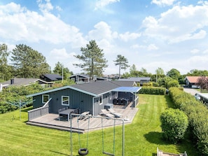 A residential area with houses, a covered outdoor seating area, and a lawn. - 4 Star Holiday Home in Haderslev (Haderslev)