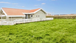 A single-story building with a red-tiled roof and a white fence in front. - 9 Person Holiday Home in Borkop-by Traum (Borkop)