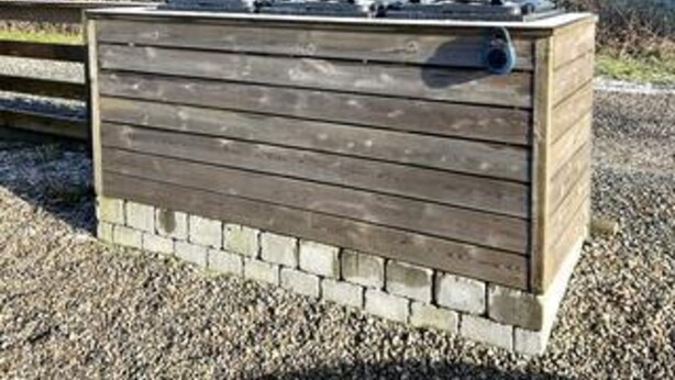 A wooden structure with a brick base, possibly a storage shed or utility box. - Simplistic Holiday Home in Blokhus With Sea Nearby (Aabenraa)