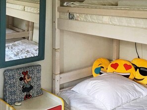 A bunk bed with a Mickey Mouse themed pillow and a mirror above it. - 6 Person Holiday Home in Aabenraa (Aabenraa)