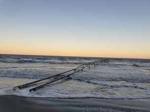 A beach with a wooden walkway extending into the ocean. - 8 Person Holiday Home in Albaek (Jerup)