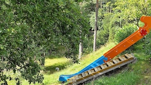 A playground with a slide and a small climbing structure. - Holiday Home in SpekerÃ¶d (Spekeröd)