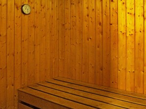 A sauna with wooden walls and a bench. - 5 Person Holiday Home in Lonashult (Lönashult)