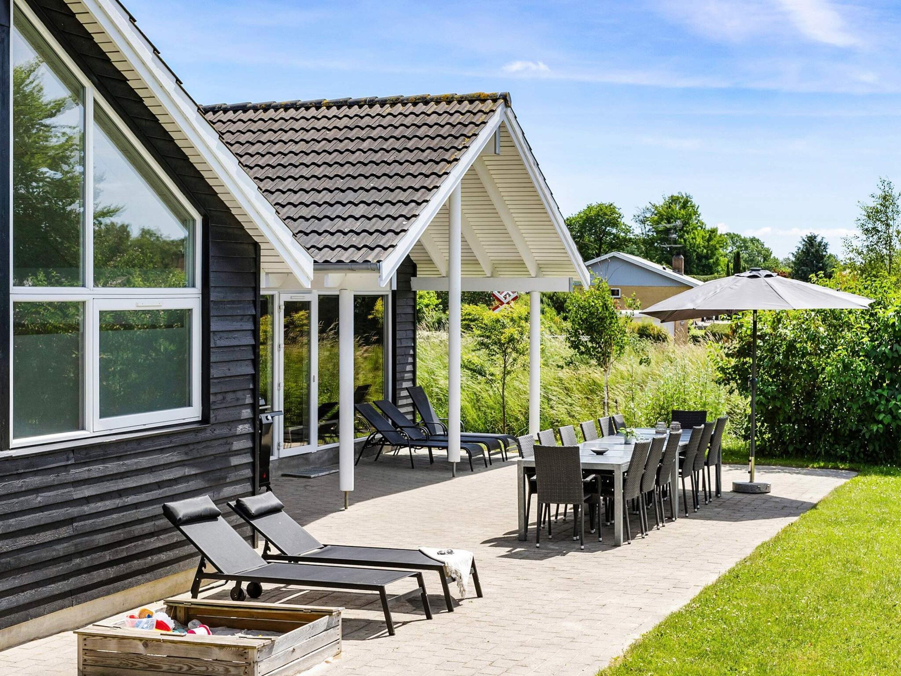 A covered patio with outdoor furniture, a pergola, and a view of the house.