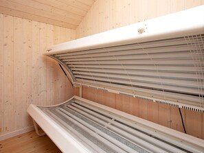 A sauna with a wooden interior and a bench. - 4 Star Holiday Home in Ringkobing (Ringkobing)