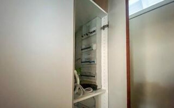 A room with a built-in shelf unit containing various items. - 4 Star Holiday Home in Hals (Hals)