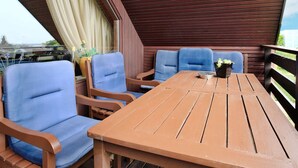 Apartamento | Restaurante al aire libre