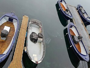 Three small boats docked at a pier. - 10 Person Holiday Home in Urangsvåg (Bomlo)