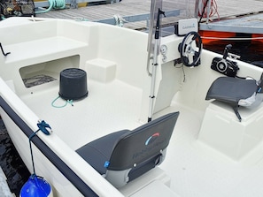 A boat interior with a Garmin navigation system, a blue buoy, and a "HobbyBoat" logo. - 6 Person Holiday Home in Bakkasund (Austevoll)