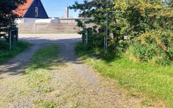 A gravel path leading to a building with a red roof. - 6 Person Holiday Home in Asnaes-by Traum (Asnaes)