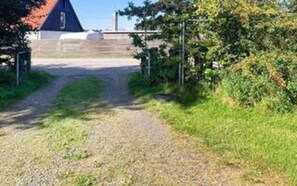 A gravel path leading to a building with a red roof. - 6 Person Holiday Home in Asnaes-by Traum (Asnaes)
