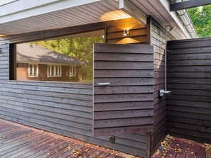A wooden exterior wall with a window and a door. - 5 Star Holiday Home in Frederiksvaerk (Frederiksvaerk)