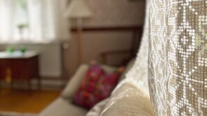 A close-up of a textured fabric, likely part of a sofa or upholstery, in a well-lit indoor setting. - 4 Star Holiday Home in Orsjo (Örsjö)