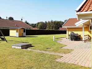 A residential property with a well-maintained lawn, a patio area with outdoor furniture, and a small shed. - 6 Person Holiday Home in Nordborg-by Traum (Nordborg)