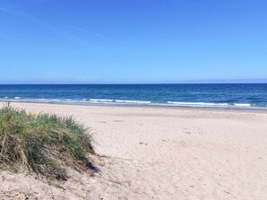 A beach with clear skies and calm sea. - 8 Person Holiday Home in Olsted-by Traum (Olsted)