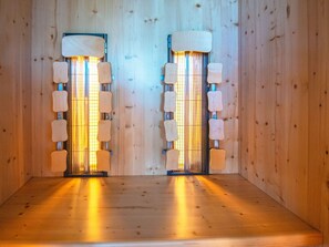 A sauna room with two wooden benches and a wooden wall. - Fantastic Holiday Home with Bay View near Knebel (Knebel)