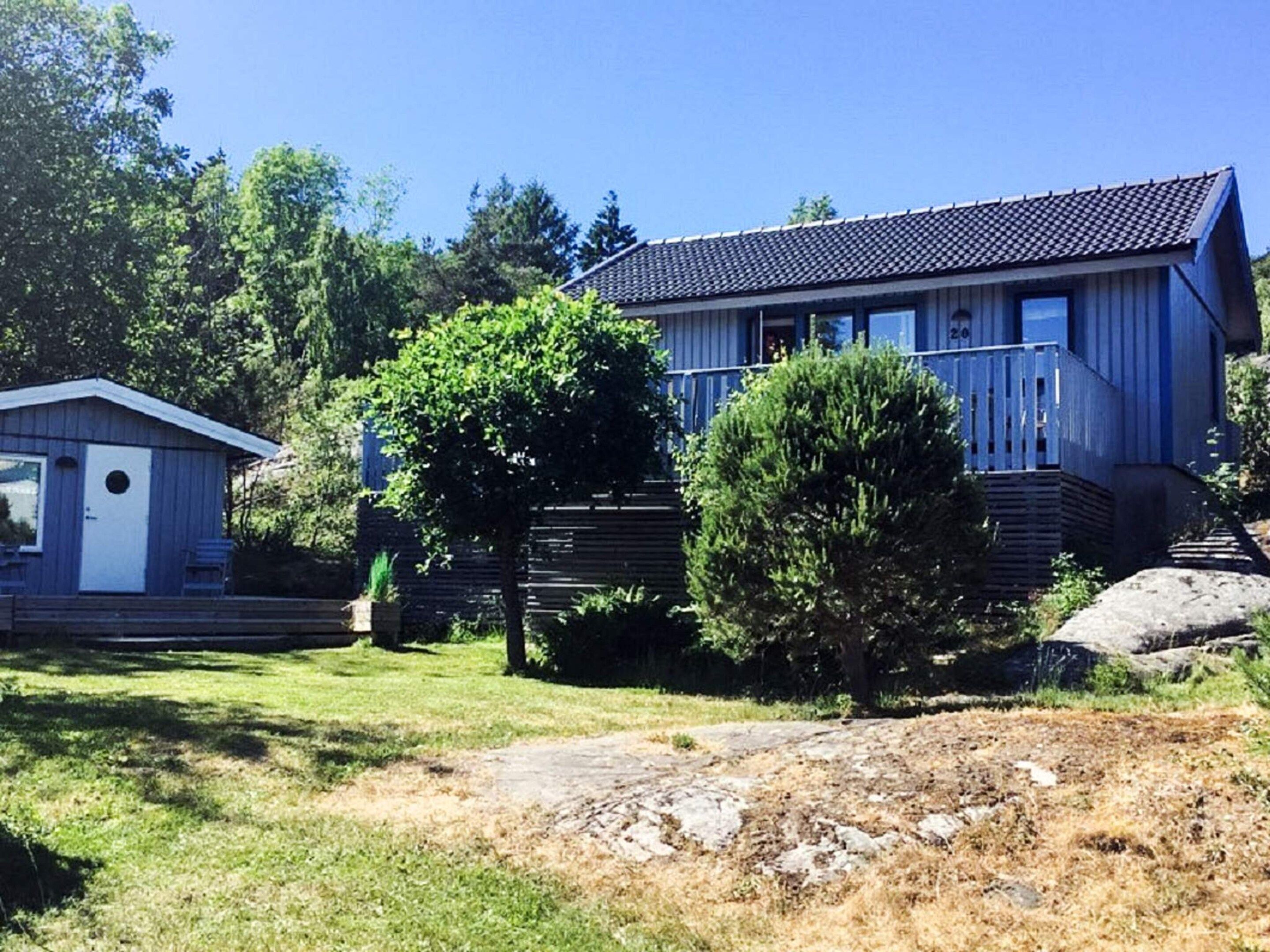 A residential property with a large house and a smaller shed.
