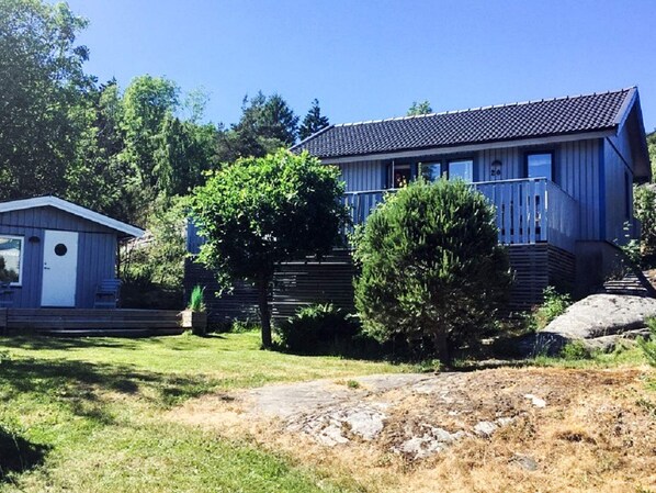 A residential property with a large house and a smaller shed.