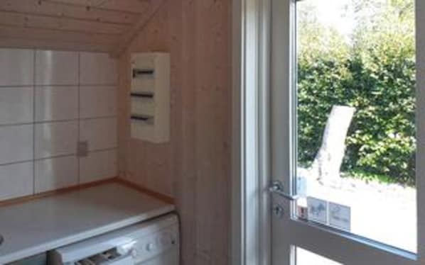 A room with a tiled wall, a window, and a door. - 4 Star Holiday Home in Gorlev (Gørlev)