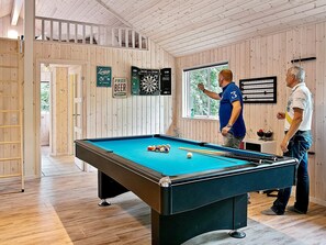 A pool table in a room with wooden walls and a window. - Pet Friendly Holiday Home in Dronningmølle near Sea (Dronningmolle)