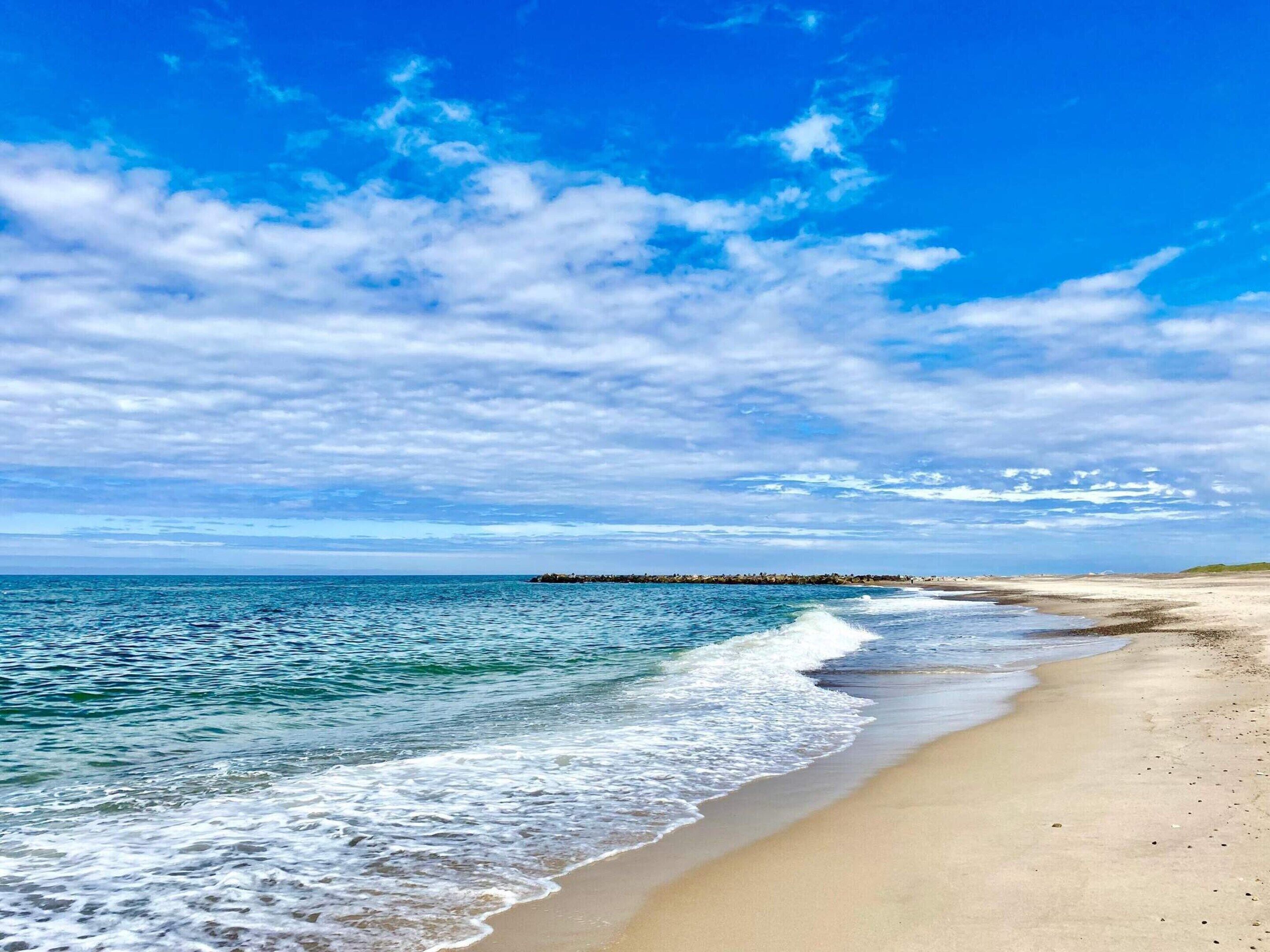 A beach with clear skies and calm waters.