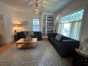 TV, fireplace, books - Renovated Gem: Walk to Beach, Historic District Shops, Restaurants, Central Park (Cape Charles)