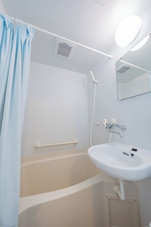 Separate tub and shower, free toiletries, hair dryer, slippers