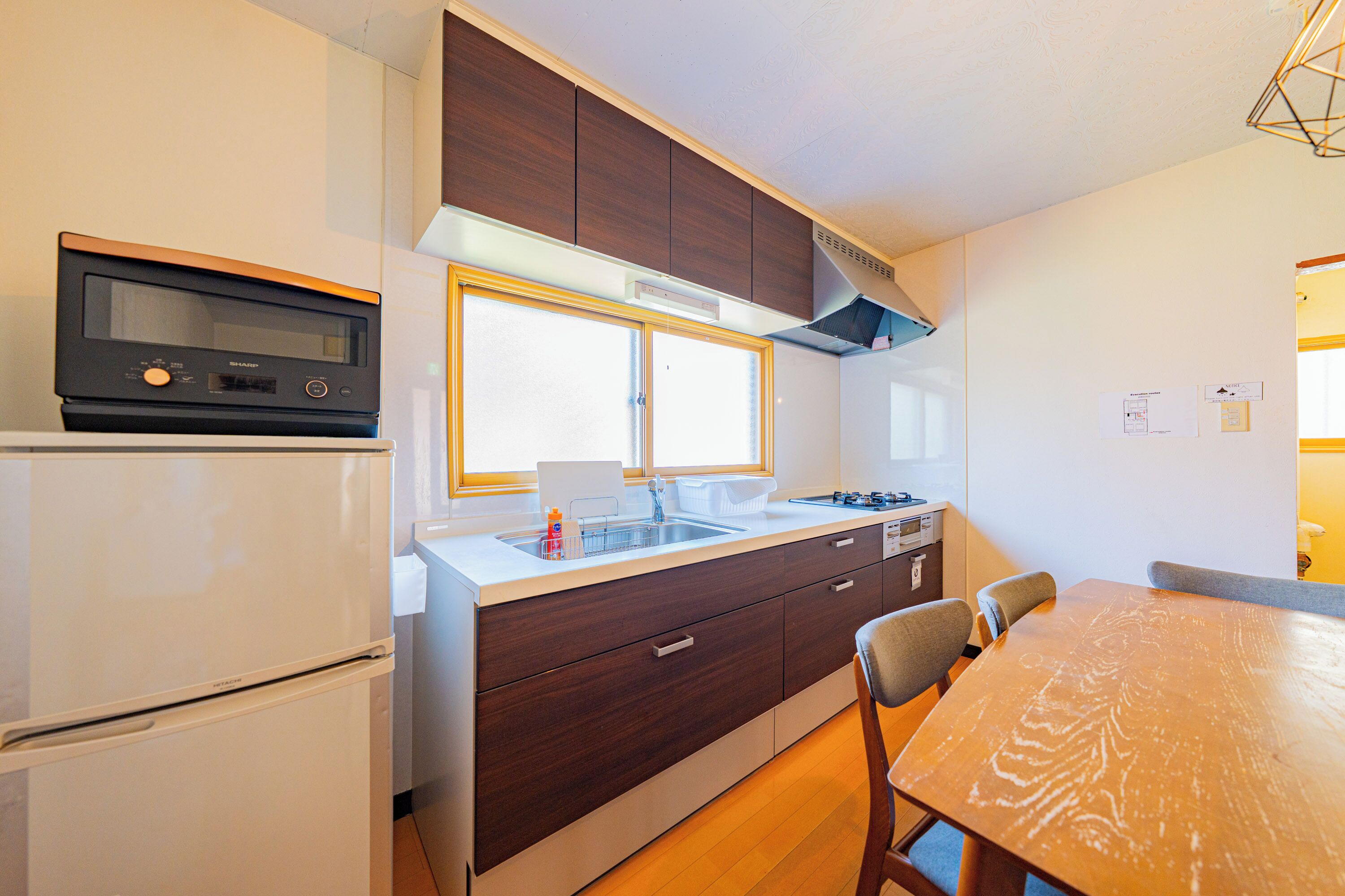 Fridge, microwave, stovetop, coffee/tea maker