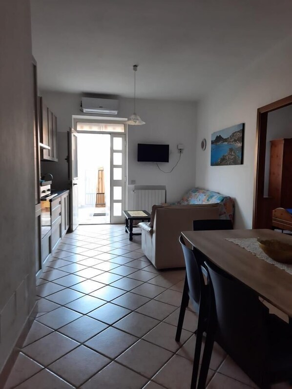 Apartment, 2 Bedrooms | Living area | 22-inch flat-screen TV with cable channels, LCD TV - Magomadas Enjoy House (Magomadas)