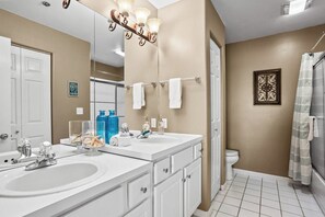 Combined shower/tub, towels, soap, shampoo