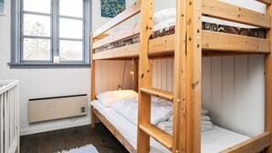 A bunk bed room with white walls, a window, and a radiator. - 8 Person Holiday Home in Frorup (Frørup)