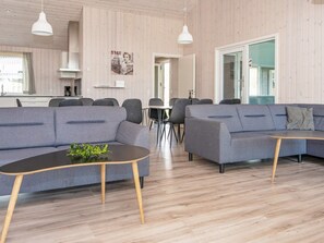 A modern living room with two sofas, a coffee table, and pendant lights. - Holiday Home in RÃ¸mÃ¸ (Rømø)