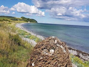A coastal landscape with a nest of eggs and a clear view of the sea. - 6 Person Holiday Home in Knebel (Knebel)