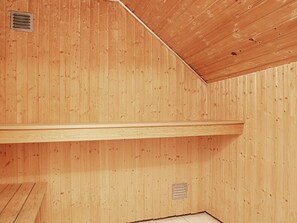 A wooden interior with a sloped ceiling and two ventilation ducts. - 12 Person Holiday Home in Vaeggerlose (Vaeggerlose)