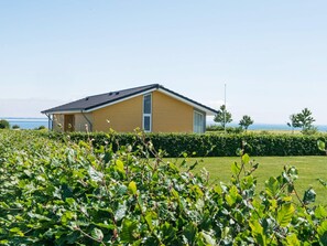 A single-story building with a sloped roof, a visible door, and a window. - 5 Star Holiday Home in Sydals (Sydals)