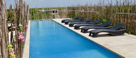 Outdoor pool, open 8:00 AM to 9:00 PM, pool umbrellas, pool loungers