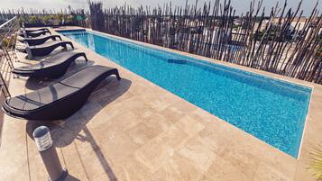 Outdoor pool, open 8:00 AM to 9:00 PM, pool umbrellas, pool loungers
