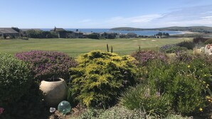 A golf course with a view of the ocean and hills in the distance. - Ocean, Golf course and Mountain Views.Walk 3/4mi to the beach (Bodega Bay)