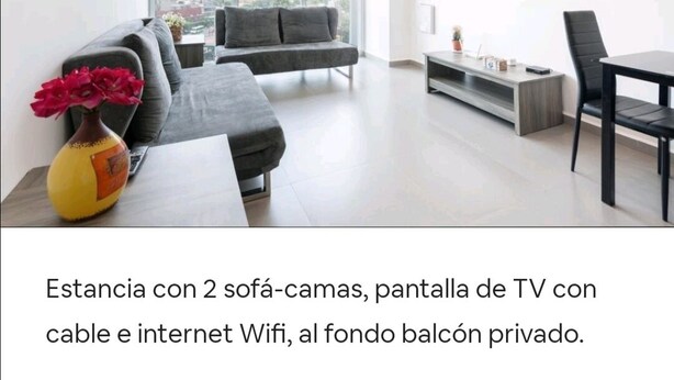 A modern living room with two sofas, a TV, and a dining area. - San Angel - UNAM Beautiful Apartment - 2 parking/3BR/2BA (Ciudad de México)
