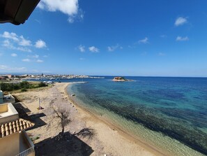 On the beach, sun loungers, beach towels