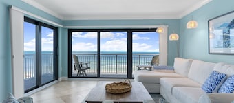 Updated direct oceanfront corner 3/2 with a wrap-around balcony, heated pool and beach access