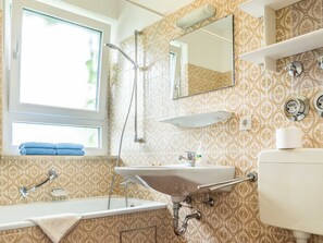 Bathtub, hair dryer, towels